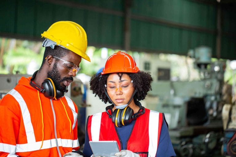 two-african-worker-check-status-task-production-line-workplace-operation-two-engineer-side-maintenance-machine-min (1)